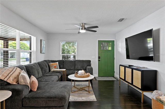 living room with wood finished floors, baseboards, and a ceiling fan