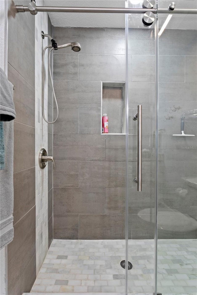 full bathroom with a shower stall