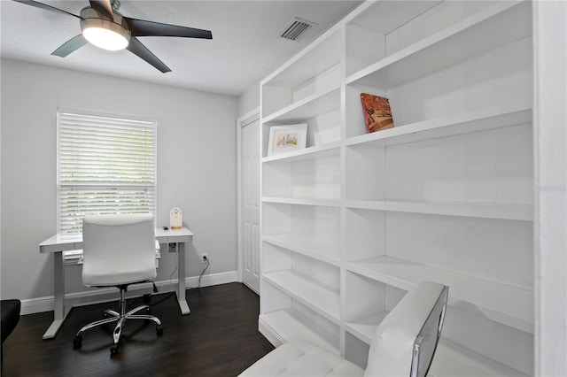 office area with dark wood-style floors, a ceiling fan, and baseboards