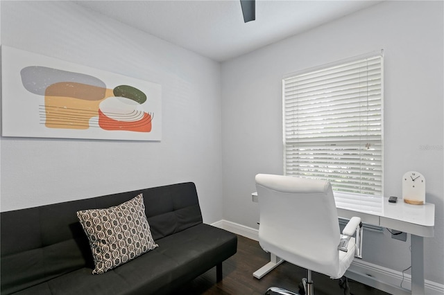 home office featuring wood finished floors and baseboards