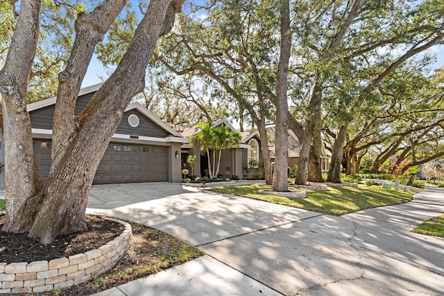 view of front of home featuring brick siding, driveway, and an attached garage