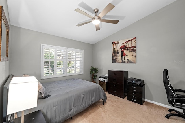 bedroom featuring light carpet, ceiling fan, lofted ceiling, and baseboards