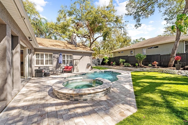 view of swimming pool featuring a patio, a yard, fence, and an in ground hot tub