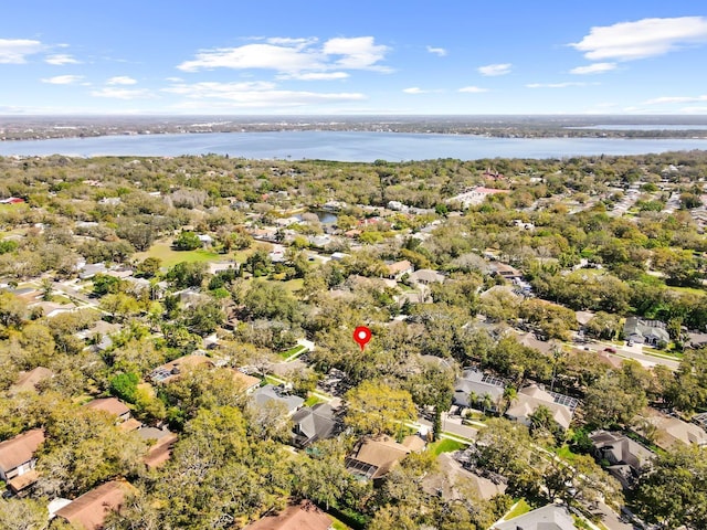 bird's eye view featuring a water view and a residential view