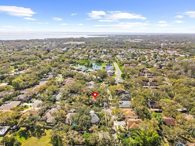 birds eye view of property with a water view and a residential view