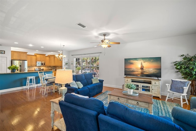 living area featuring recessed lighting, visible vents, wood finished floors, baseboards, and ceiling fan with notable chandelier