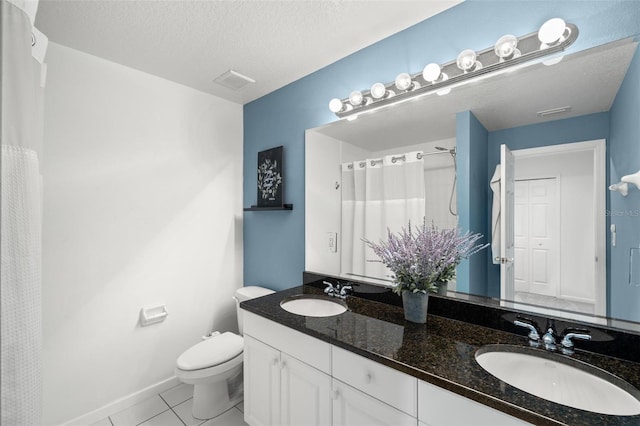 full bathroom featuring toilet, a textured ceiling, a sink, and tile patterned floors