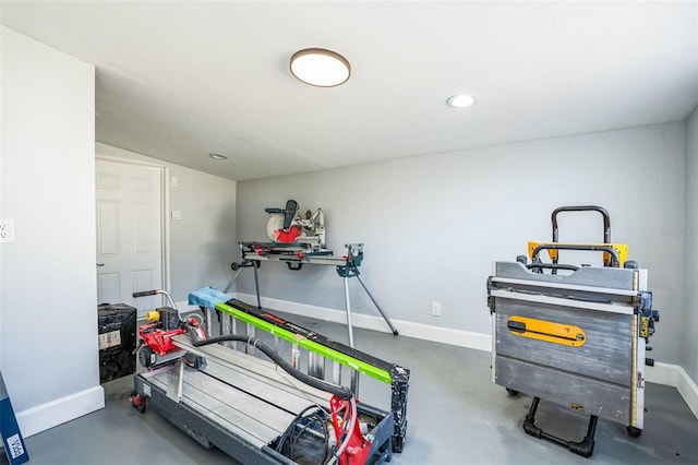 exercise area with baseboards and recessed lighting