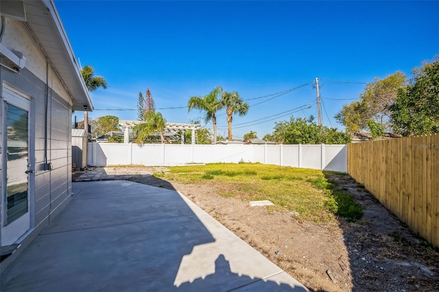 view of yard with a fenced backyard and a patio