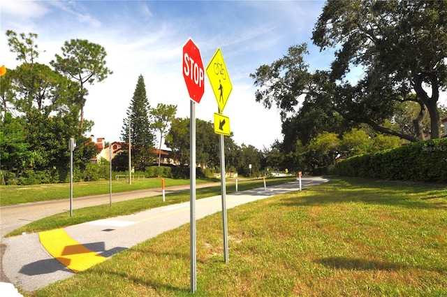 surrounding community featuring a yard