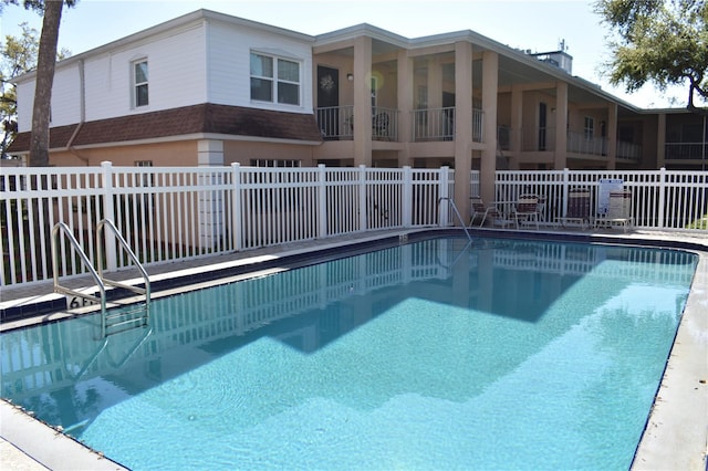 pool featuring fence