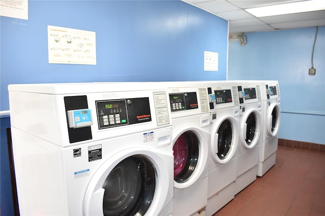 common laundry area with baseboards and separate washer and dryer