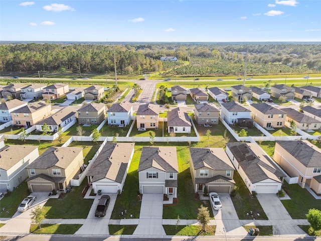 aerial view featuring a residential view and a view of trees