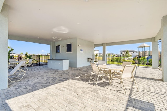 view of patio / terrace featuring fence and outdoor dining space