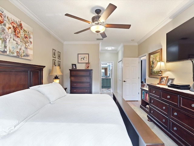 bedroom with ceiling fan, ornamental molding, light colored carpet, and ensuite bathroom