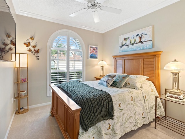 bedroom with ornamental molding, light colored carpet, a textured ceiling, and baseboards