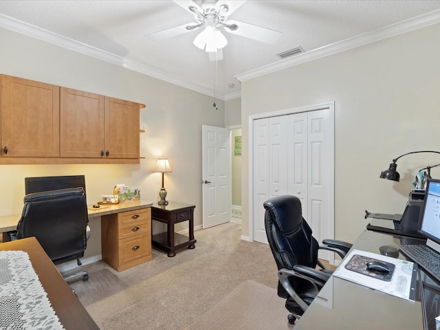 office with light carpet, crown molding, visible vents, and ceiling fan