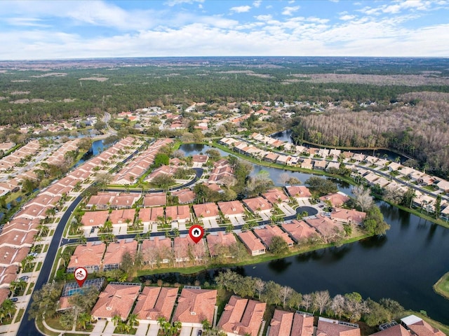 drone / aerial view featuring a water view and a residential view