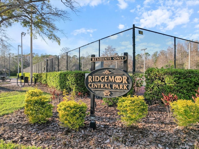 community sign with fence