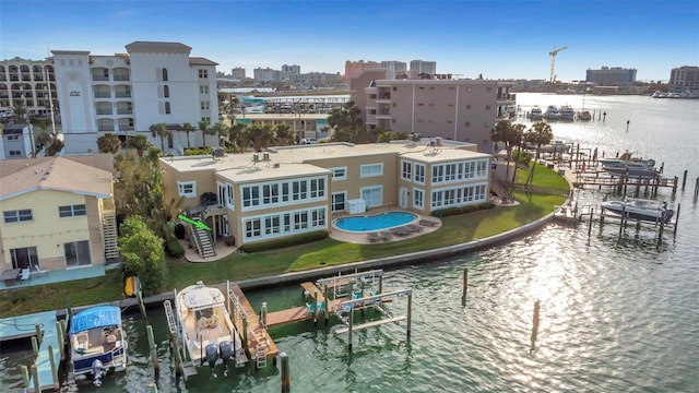 birds eye view of property with a water view