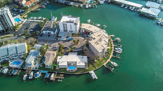 birds eye view of property with a water view