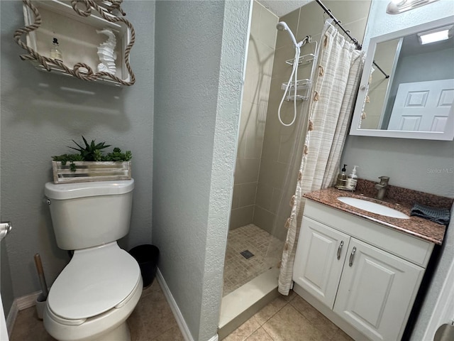 bathroom with toilet, a stall shower, baseboards, and tile patterned floors