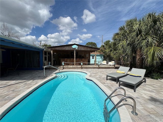 view of swimming pool featuring a patio area and a fenced in pool