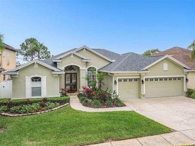 ranch-style house with driveway, a shingled roof, stucco siding, french doors, and a garage