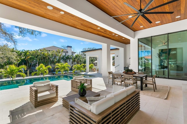 view of patio / terrace featuring outdoor lounge area, a ceiling fan, and an outdoor pool