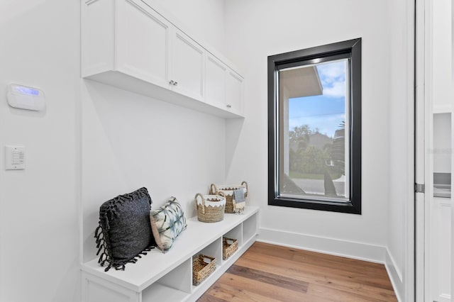 mudroom with light wood-type flooring and baseboards