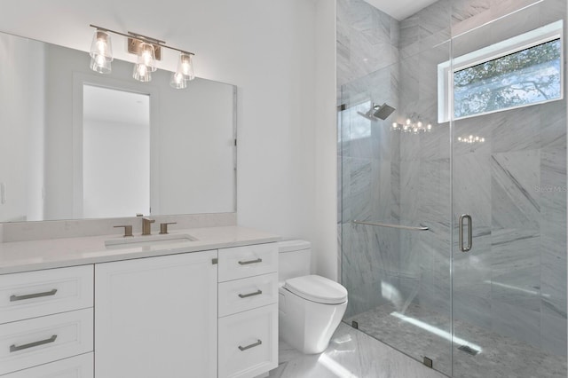 bathroom with toilet, marble finish floor, a shower stall, and vanity