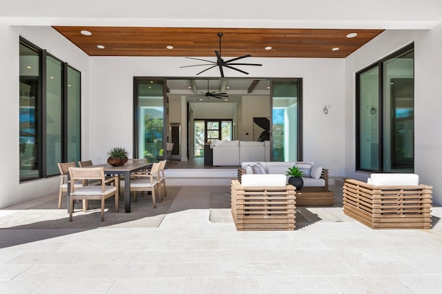 view of patio featuring a ceiling fan, outdoor dining area, and outdoor lounge area