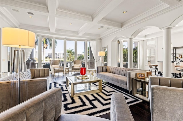 living room with beam ceiling, decorative columns, ornamental molding, wood finished floors, and coffered ceiling