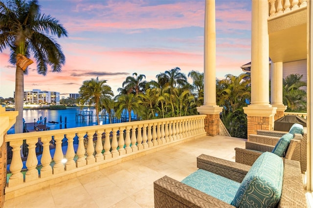 balcony at dusk with a water view