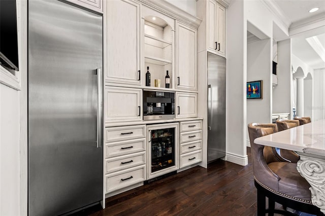 kitchen featuring beverage cooler, open shelves, built in fridge, and dark wood finished floors