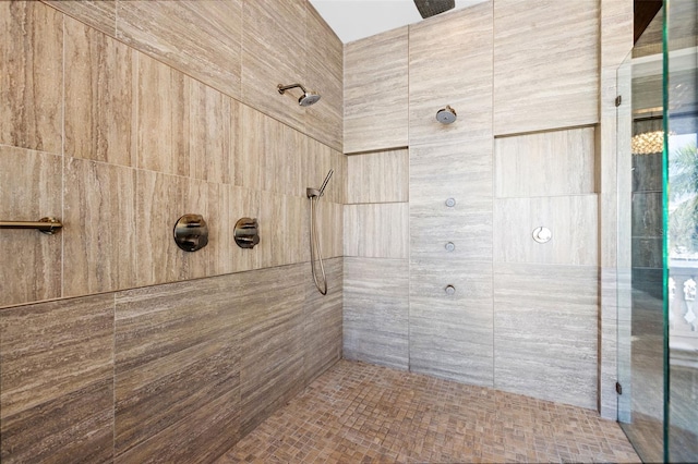 full bath with a tile shower