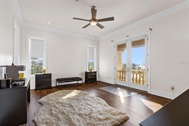 interior space with baseboards, french doors, wood finished floors, and crown molding