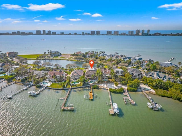 birds eye view of property featuring a water view