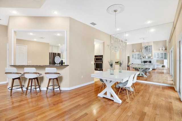 dining room featuring a chandelier, recessed lighting, visible vents, and light wood-style flooring