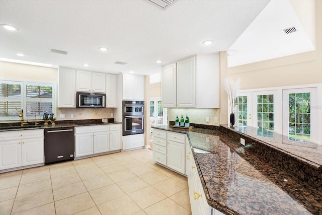 kitchen with black dishwasher, visible vents, white cabinets, stainless steel double oven, and a sink