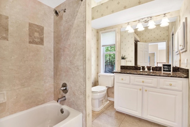 bathroom featuring wallpapered walls, toilet, tile patterned floors, bathtub / shower combination, and vanity