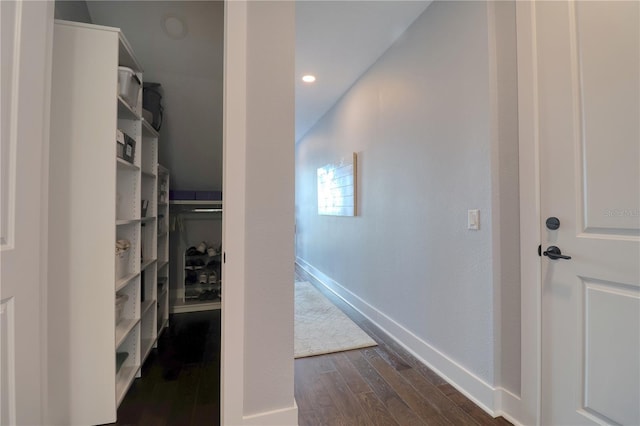 interior space with dark wood-type flooring, recessed lighting, and baseboards