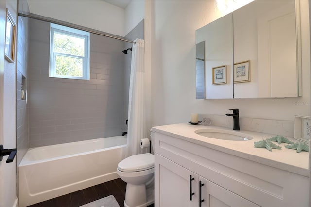 full bath featuring vanity, shower / tub combo, wood finished floors, and toilet