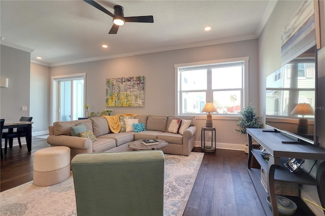 living area with baseboards, dark wood-style flooring, recessed lighting, and crown molding