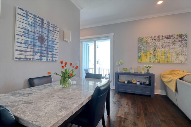 dining room with recessed lighting, dark wood-style flooring, crown molding, and baseboards