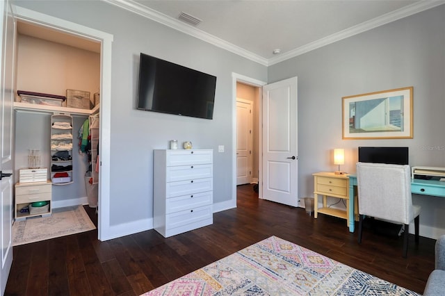 bedroom featuring visible vents, crown molding, baseboards, and hardwood / wood-style flooring