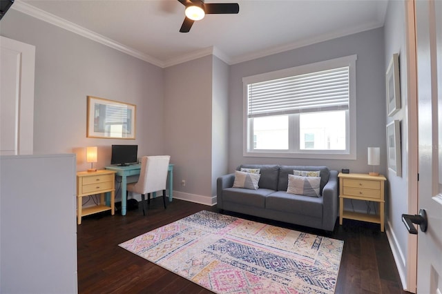 office space featuring dark wood-style floors, crown molding, baseboards, and a ceiling fan