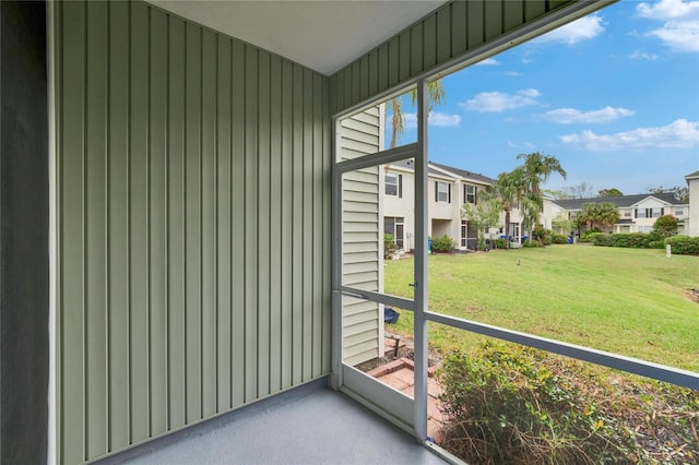 unfurnished sunroom with a residential view