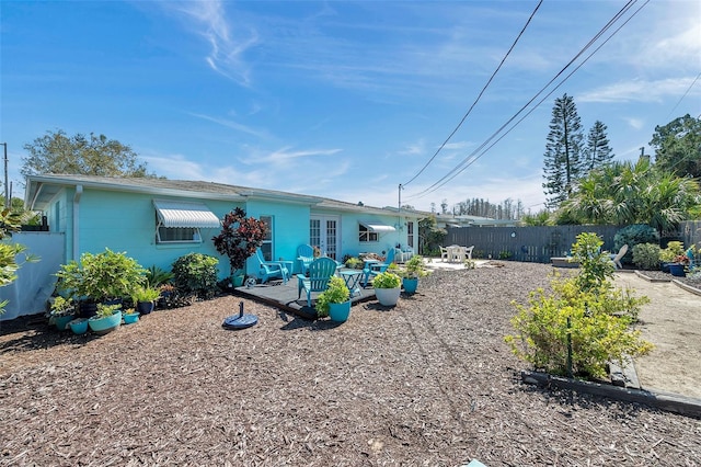 back of house featuring fence private yard and a patio area