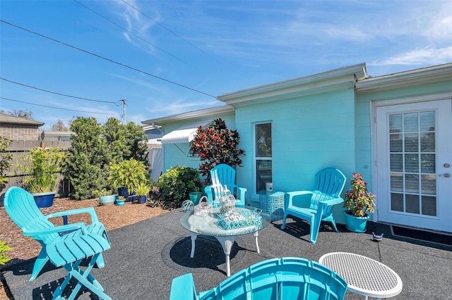 view of patio / terrace featuring fence